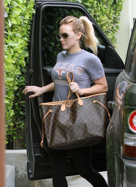 celebrities wearing louis vuitton neverfull bag